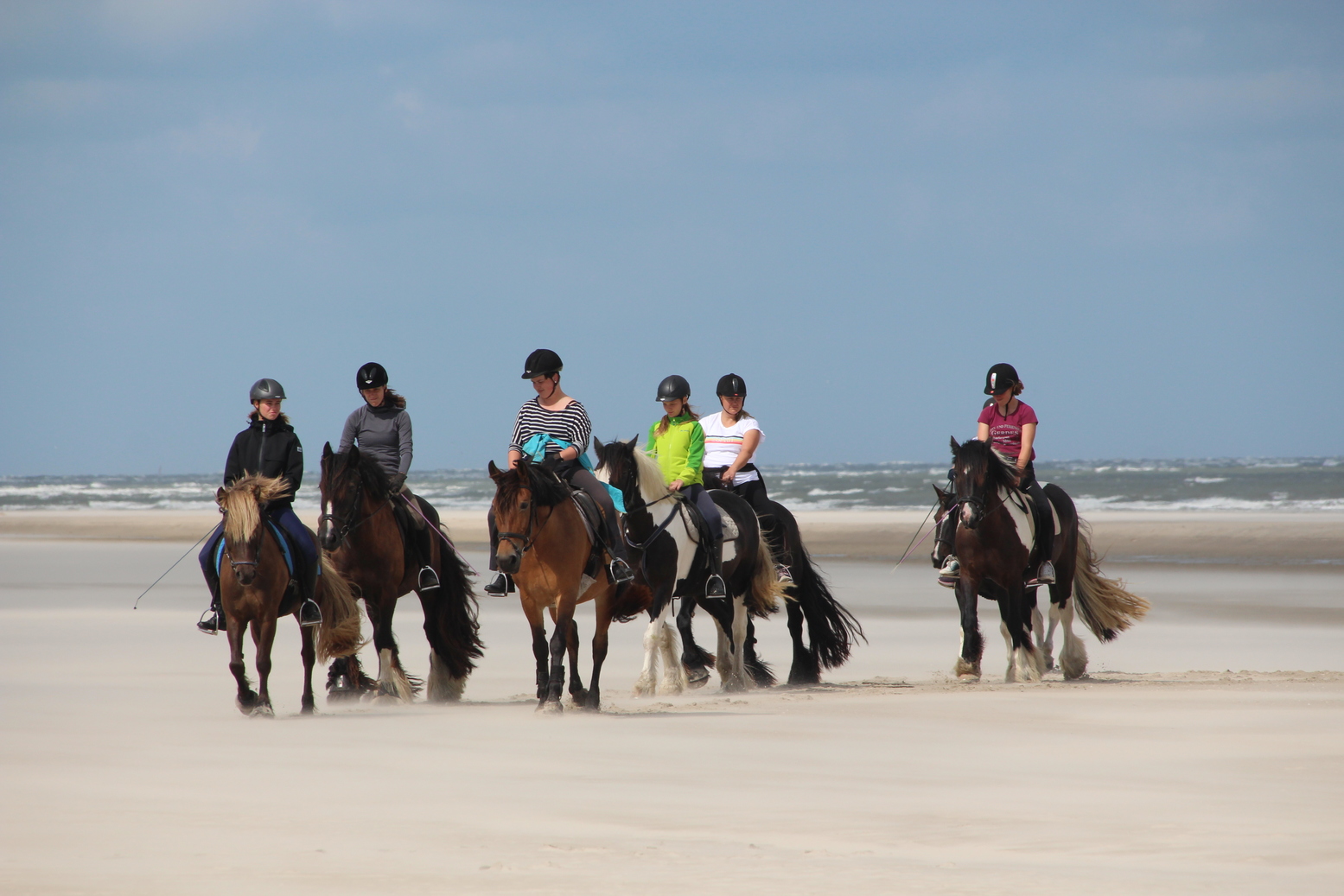 Horse back riding at the beach of Langeoog (Germany)