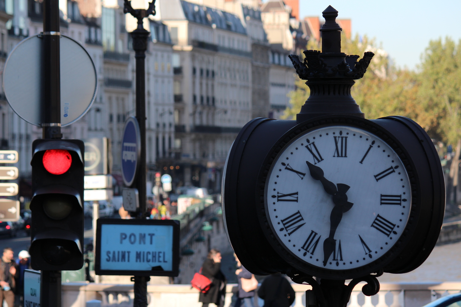 Clock in the streets of Paris in front of Pont Saint Michel